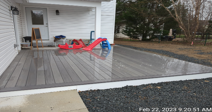 Outdoor play area with deck and slide